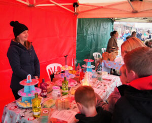 A table covered in assorted sweets and bottles