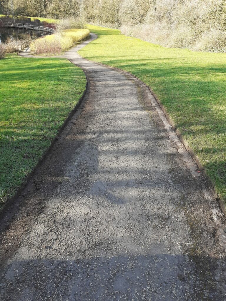A clean, straight footpath, with freshly-trimmed edges