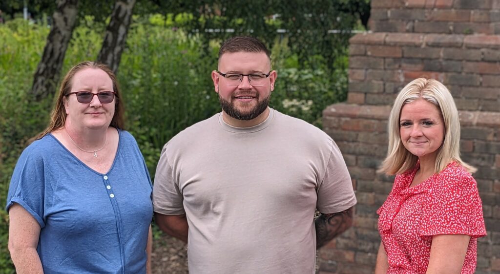 Photo of 3 people standing next to each other