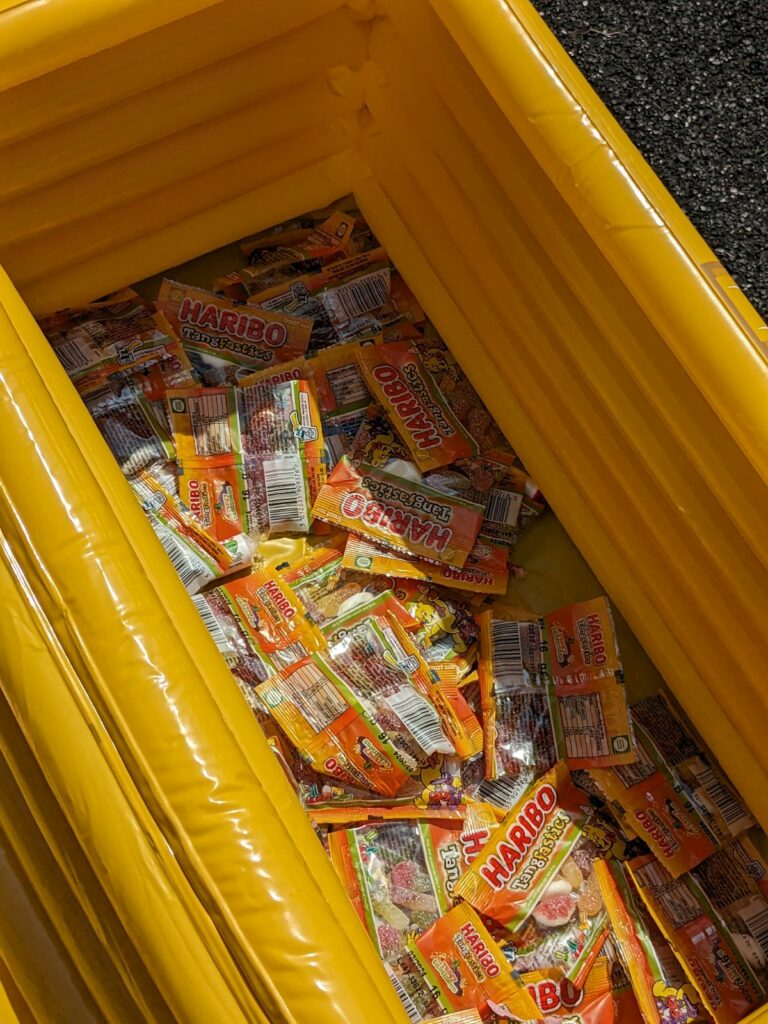An inflatable tray full of packets of Haribo sweets