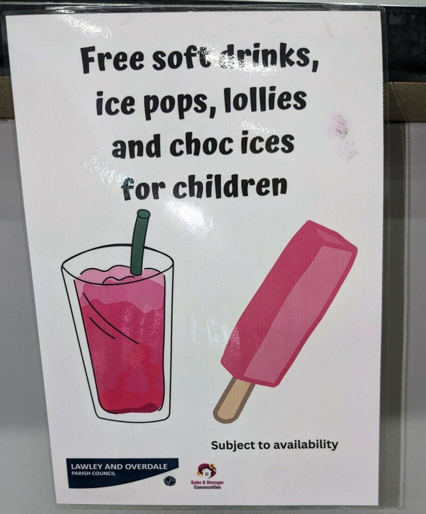 A sign that reads "Free soft drinks, ice pops, lollies, and choc ices for children"