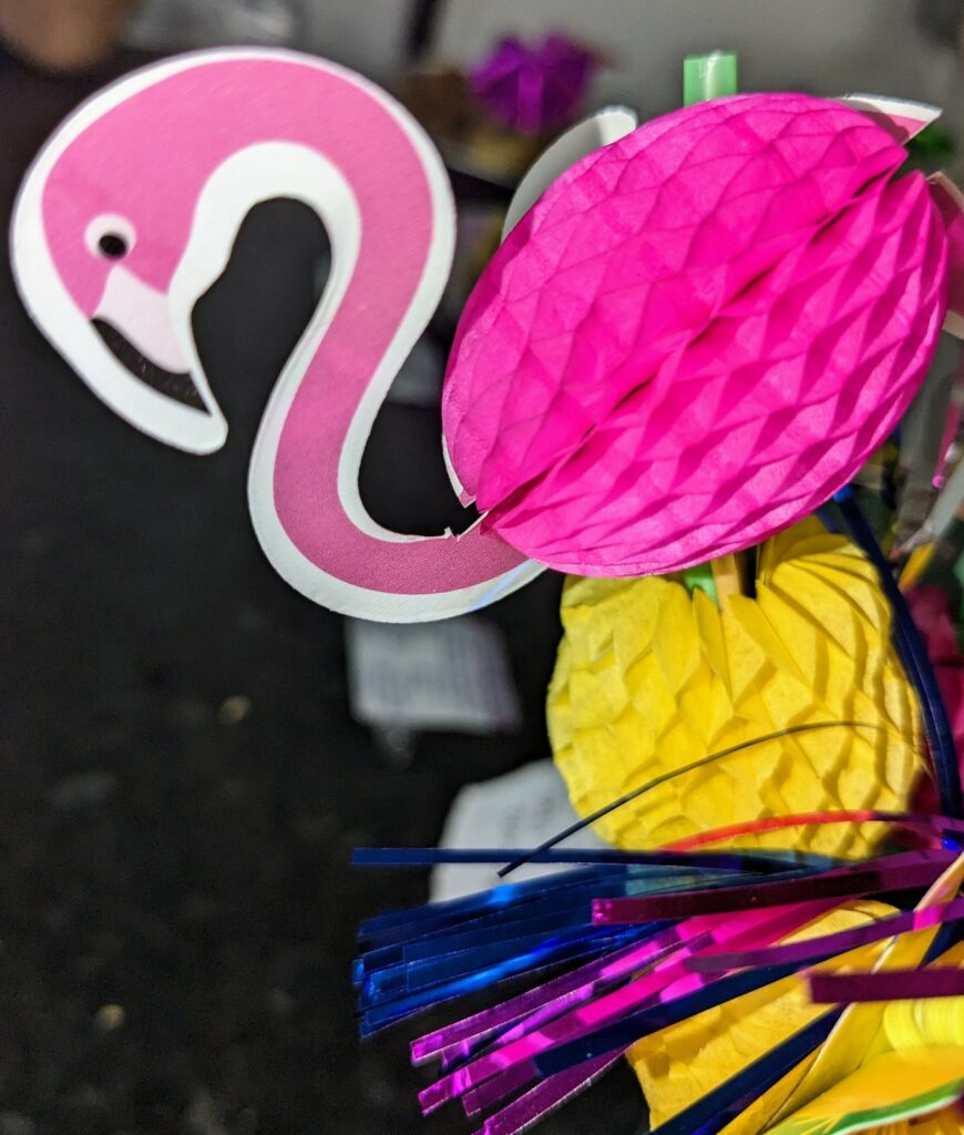 An assortment of decorations, most prominent of which is a cutout of a flamingo