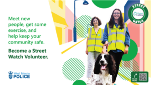image of two people walking with a dog on a lead.